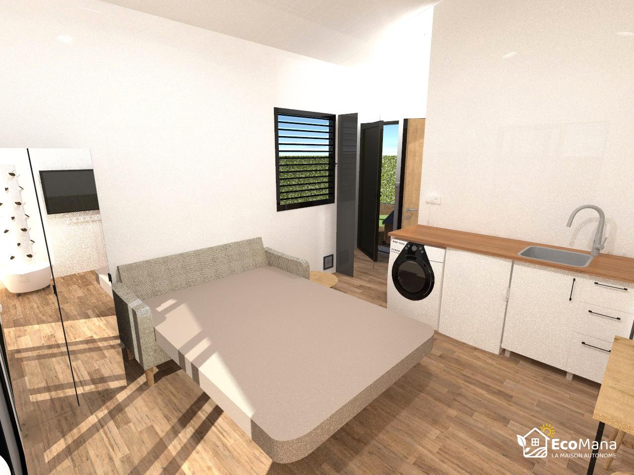 Canapé déplié en lit, à côté de la kitchenette